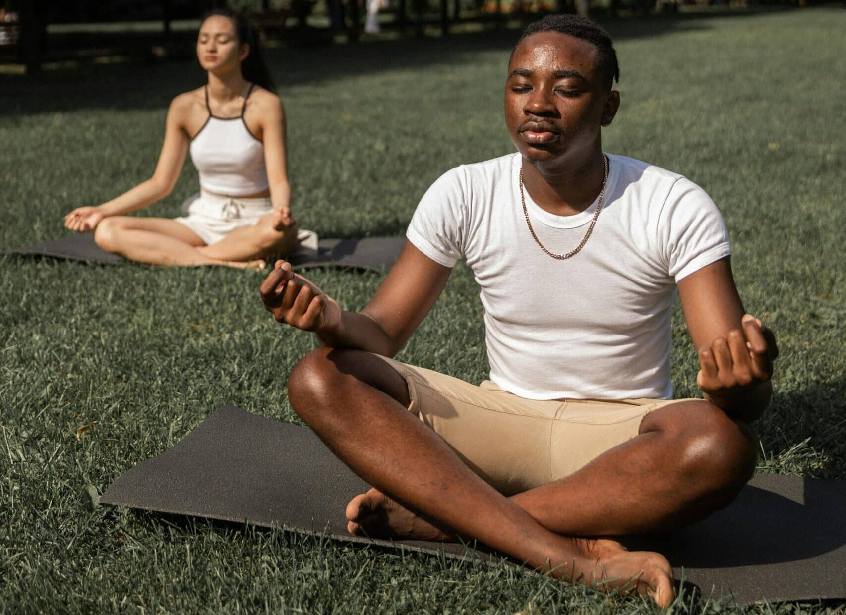 Two people doing sitting meditation.