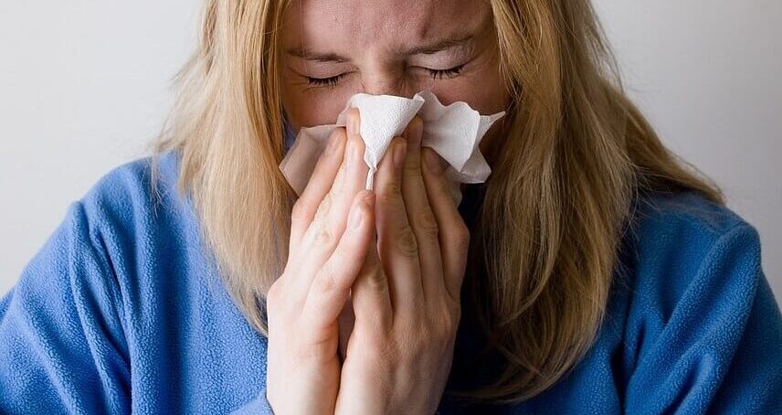 Woman sneezing